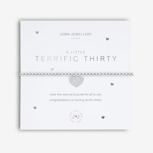 Joma Jewellery 'a little' bracelet with pretty little charm, presented on a sentiment card which reads:  'Wear this little bracelet for all to see, congratulations on turning terrific thirty!'  Beautifully packaged in it's own Joma Jewellery envelope and gifting card.