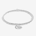 Joma Jewellery 'a little' bracelet with pretty little charm, presented on a sentiment card which reads:  'This charm is to fill your heart with glee, congratulations on fabulous forty!'  Beautifully packaged in it's own Joma Jewellery envelope and gifting card.