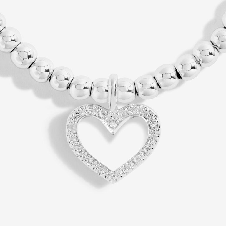 Joma Jewellery 'a little' bracelet with pretty little charm, presented on a sentiment card which reads:  'This special little bracelet is just to say, you're turning sixty – hip hip hooray!'  Beautifully packaged in it's own Joma Jewellery envelope and gifting card.