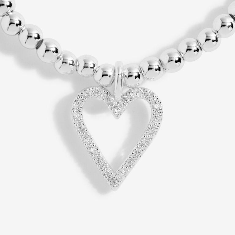 Joma Jewellery 'a little' bracelet with pretty little charm, presented on a sentiment card which reads:  'This special little bracelet is just to say, you're turning seventy – hip hip hooray!'  Beautifully packaged in it's own Joma Jewellery envelope and gifting card.