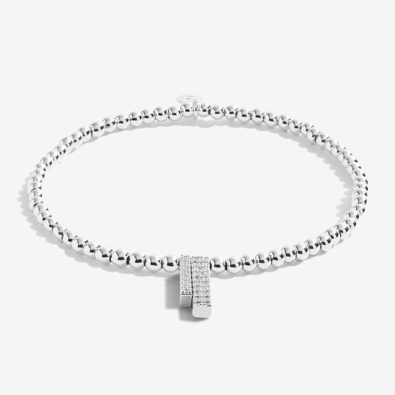 Joma Jewellery 'a little' bracelet with pretty little charm, presented on a sentiment card which reads:  'This special bracelet will make you grin, I'll always be with you through thick and thin'  Beautifully packaged in it's own Joma Jewellery envelope and gifting card.