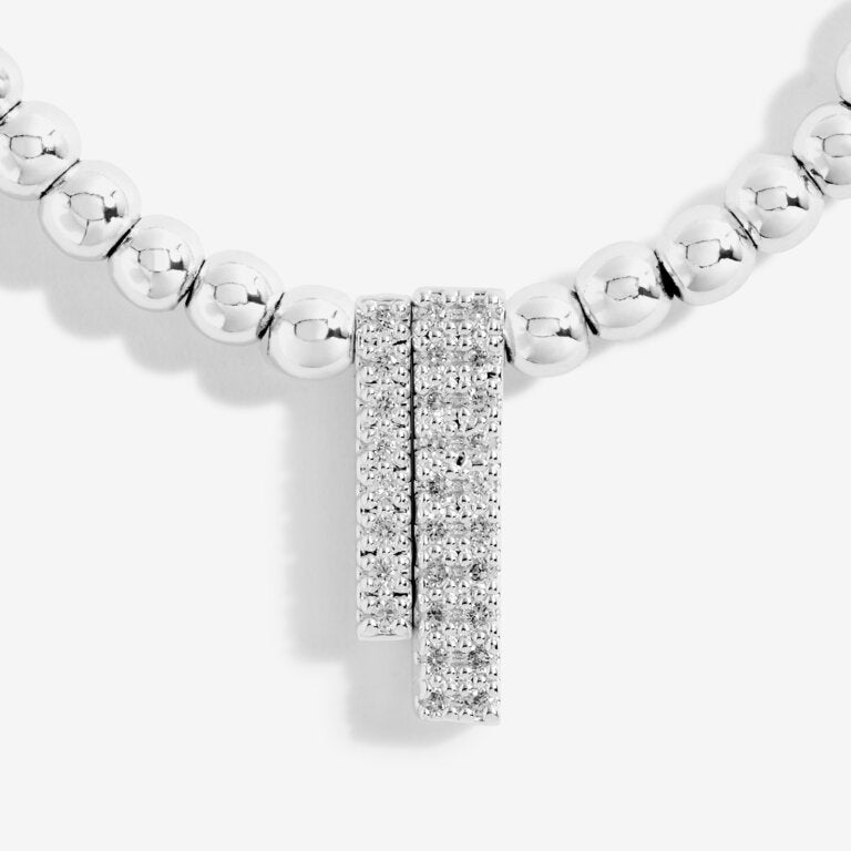 Joma Jewellery 'a little' bracelet with pretty little charm, presented on a sentiment card which reads:  'This special bracelet will make you grin, I'll always be with you through thick and thin'  Beautifully packaged in it's own Joma Jewellery envelope and gifting card.