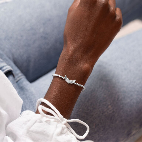Joma Jewellery 'a little' bracelet with pretty little charm, presented on a sentiment card which reads:  'This little bracelet is yours to treasure, you'll have little wings to fly now and forever'  Beautifully packaged in it's own Joma Jewellery envelope and gifting card.