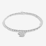 Joma Jewellery 'a little' bracelet with pretty little charm, presented on a sentiment card which reads:  'Wear this charm bracelet with all you do, and know angels are watching over you'  Beautifully packaged in it's own Joma Jewellery envelope and gifting card.