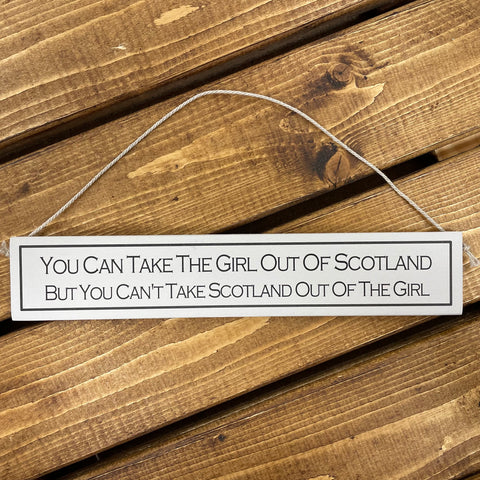This wooden sign has to be the perfect gift for friends who love a little Scottish humour.    Rustic hanging wooden sign - hand painted with the printed slogan:  'You can take the girl out of Scotland, but you can't take Scotland out of the girl.'  Handmade in the UK