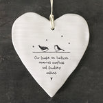 White Hanging Porcelain 'Wobbly' Round Heart from East of India which reads:  'Our laughs are limitless, memories countless and friendship endless.'  The heart features an engraved illustration in East of India's unique style.