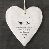 White Hanging Porcelain 'Wobbly' Round Heart from East of India which reads:  'Our laughs are limitless, memories countless and friendship endless.'  The heart features an engraved illustration in East of India's unique style.