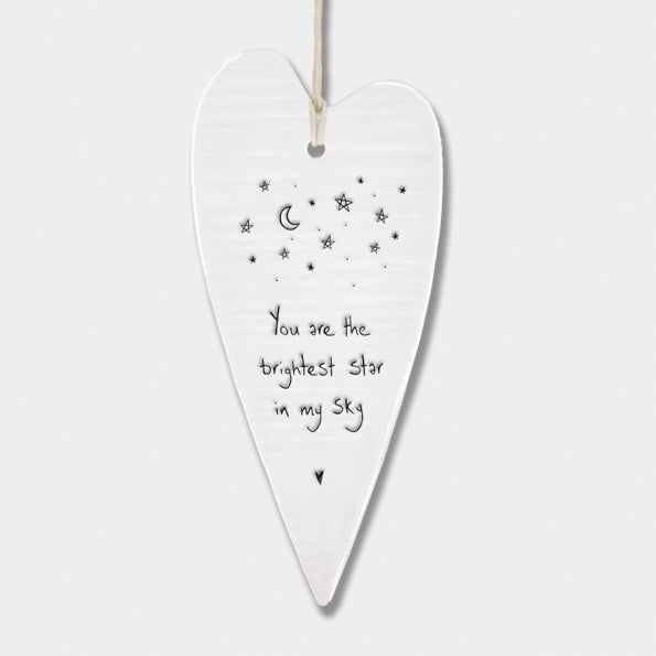 White Hanging 'Wobbly' Long Porcelain Heart from East of India which reads:  'You are the brightest star in my sky.'   The heart features an engraved illustration in East of India's unique style.