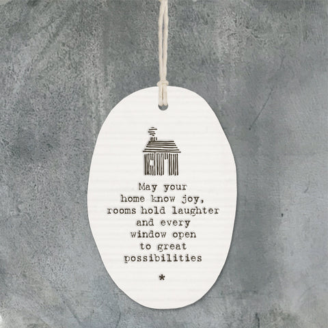 White Hanging Porcelain Hanger from East of India which reads:  'May your home know joy, rooms hold laughter and every window open to great possibilities'