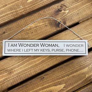 This hilarious wooden sign has to be the perfect gift for the forgetful woman in your life, or just to cheer yourself up with a little bit of humour.   Rustic hanging wooden sign - hand painted with the printed slogan:  'I am wonder woman, i wonder where i left my keys, purse, phone...'  Handmade in the UK