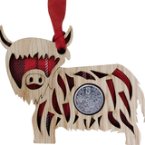 Lucky sixpence on hanging wooden highland cow with tartan 
