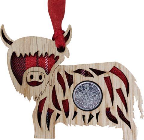 Lucky sixpence on hanging wooden highland cow with tartan 