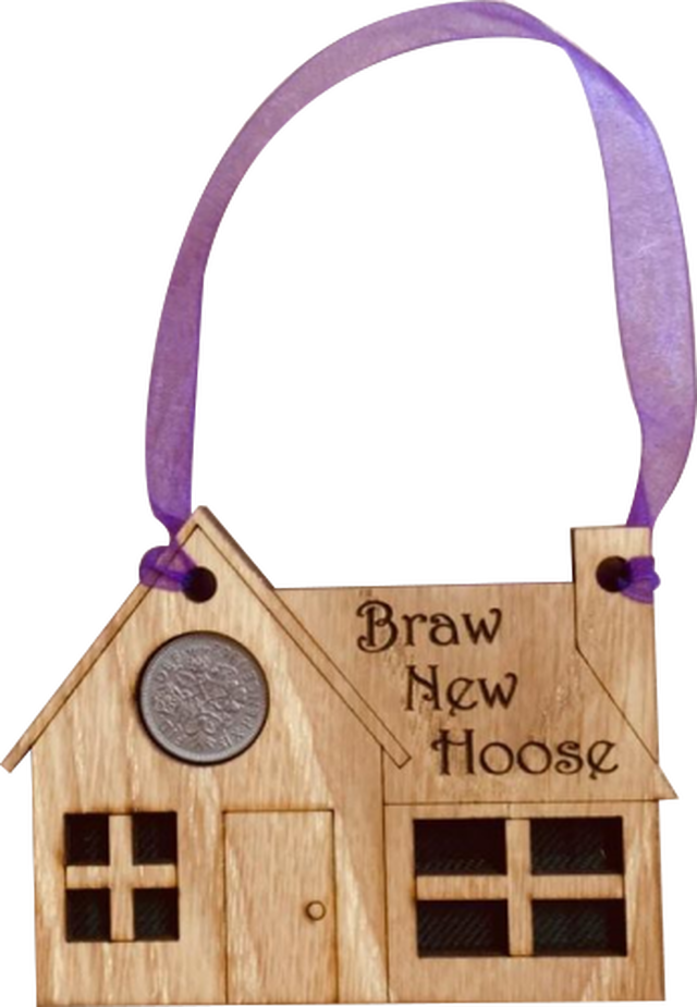 A unique keepsake gift with a Scottish twist.  The sixpence is mounted onto a hanging oak veneered wooden house with tartan inserts, mounted on card and packaged in clear cellophane packets.