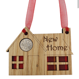 A unique keepsake gift with a Scottish twist.  The sixpence is mounted onto a hanging oak veneered wooden house with tartan inserts, mounted on card and packaged in clear cellophane packets.