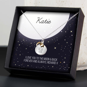 This cute personalised sterling silver necklace with gold plated moon & stars charms comes presented in it's own gift box including personalised sentiment card.  It also features a small cubic zirconia which is inset below the engraving.