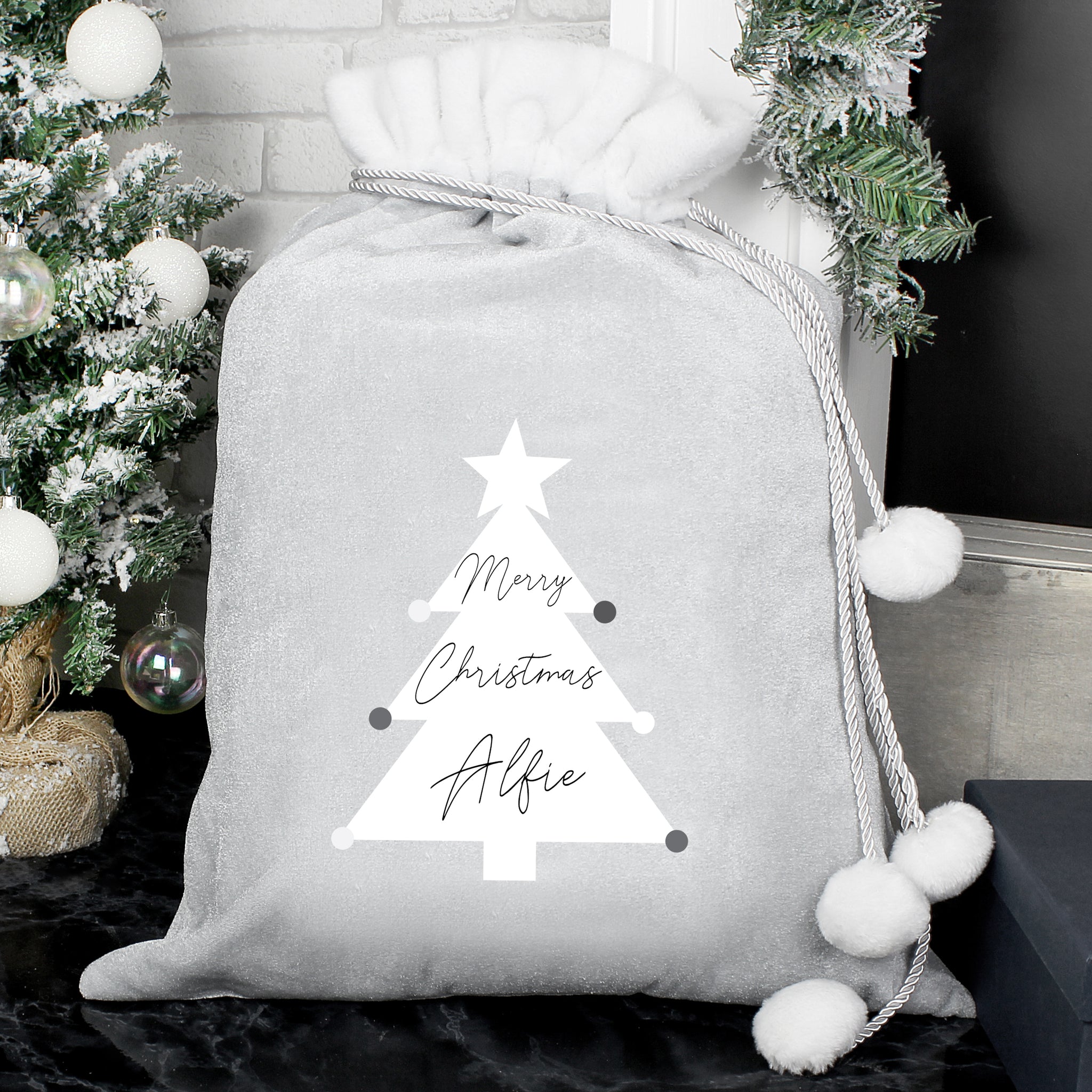 This personalised Christmas sack is the perfect way to present Christmas gifts and looks super luxurious too with beautiful pom pom ties.  It can be stored to use for that little bit of luxury year after year.  This pretty santa sack can be personalised with a name up to 10 characters in length. Please refrain from using fixed upper case as this may make the personalisation hard to read. The words 'Merry Christmas' is fixed text.