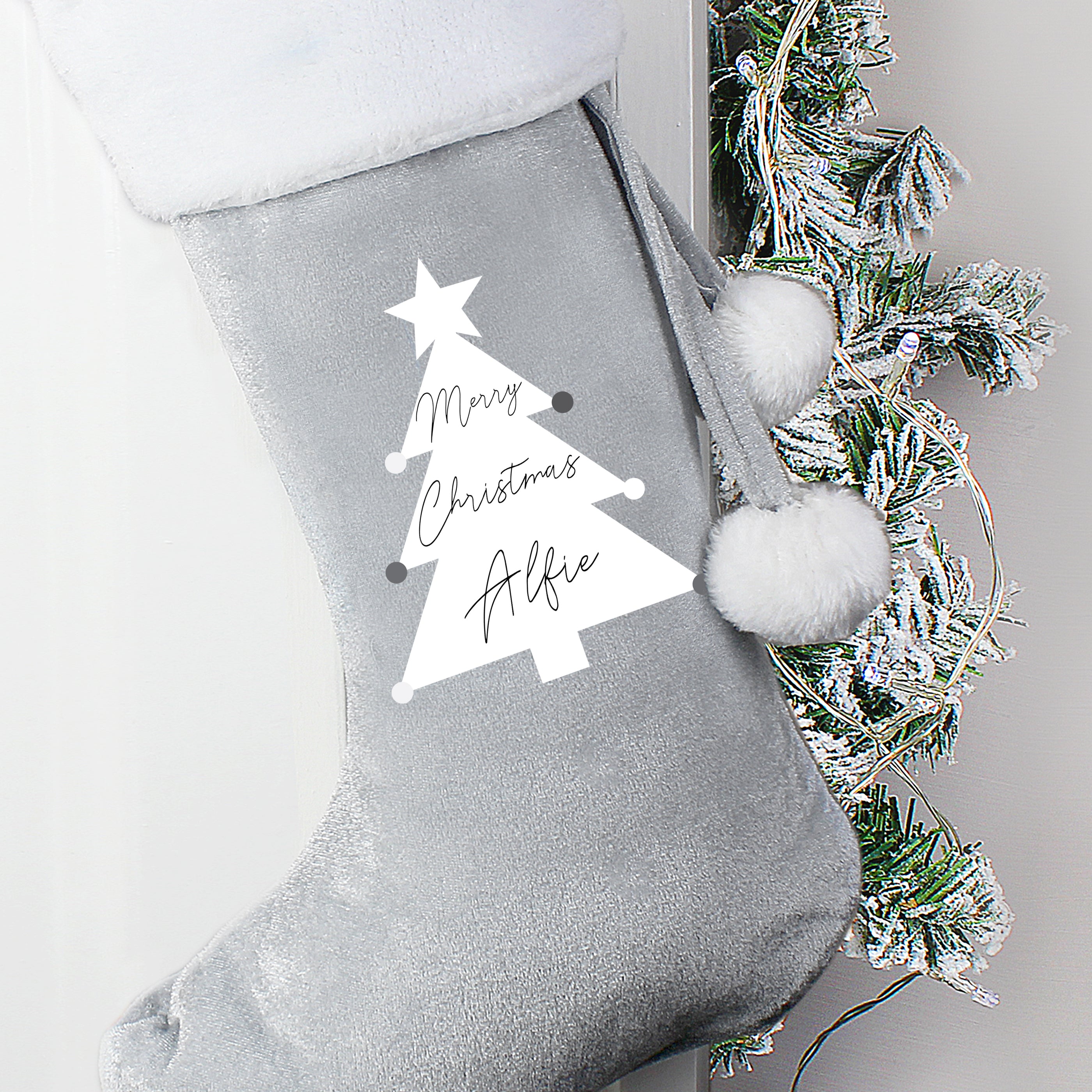 This personalised Christmas tree stocking is perfect for all those little stocking fillers, and looks super luxurious too. Beautiful Christmas decoration which can be stored to use year after year.  This pretty stocking can be personalised with a name up to 10 characters in length. All text is case sensitive and will appear as entered, 'Merry Christmas' is fixed