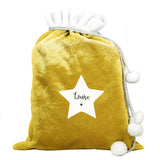 This personalised Christmas star sack is the perfect way to present Christmas gifts and looks super luxurious too with beautiful pom pom ties.  It can be stored to use for that little bit of luxury year after year.  This pretty stocking can be personalised with a name up to 12 characters long.