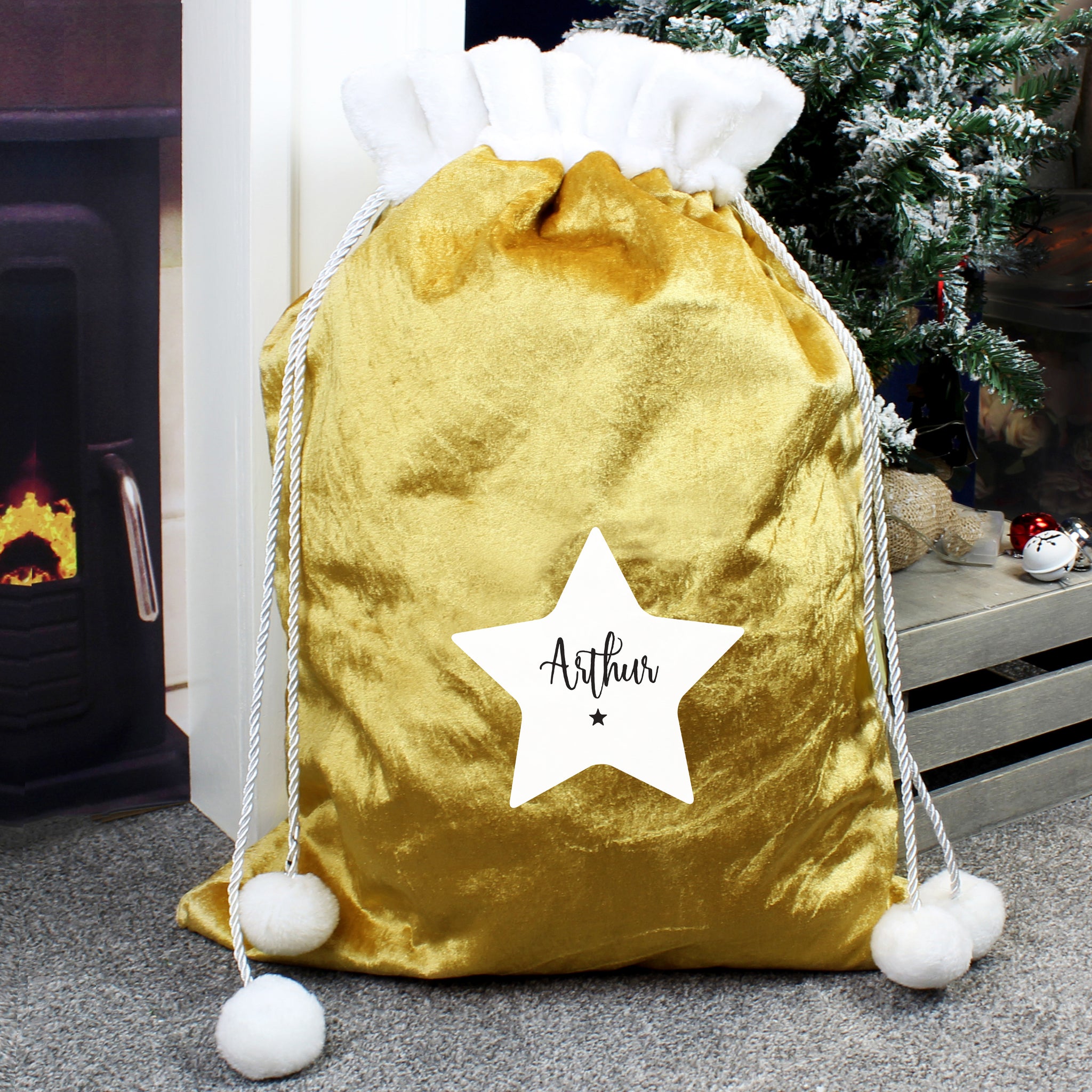 This personalised Christmas star sack is the perfect way to present Christmas gifts and looks super luxurious too with beautiful pom pom ties.  It can be stored to use for that little bit of luxury year after year.  This pretty stocking can be personalised with a name up to 12 characters long.