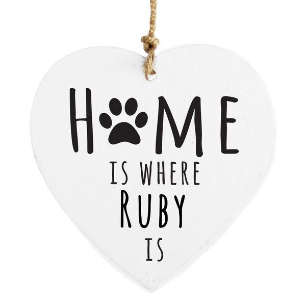 Personalised Pet wooden heart hanging decoration - create the perfect gift for all pet lovers.  Personalise this wooden heart decoration with a pet's name up to 12 characters. The personalisation will appear in fixed upper case. The words 'Home is where' and 'is' are fixed.