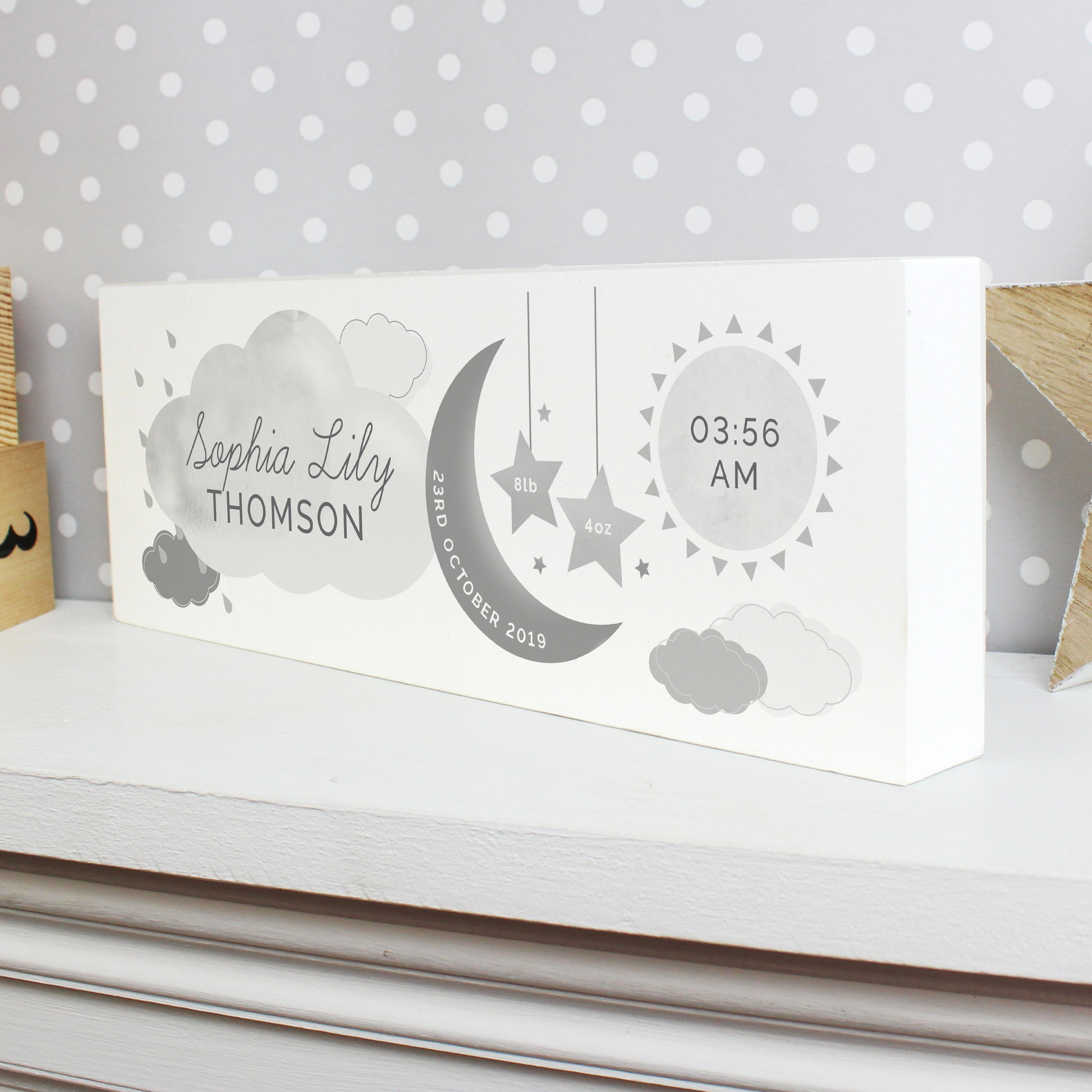 Adorable personalised moon & stars wooden block decoration, a fabulous way of welcoming a new baby to the world.  This sign can be personalised with a first name with 12 characters which is case sensitive and surname with 12 characters which is fixed upper case (on cloud). Date: 20 characters (on moon) Fixed upper case. Weight:  4 characters (on left star) and 4 characters (on right star) Case sensitive. Time : 5 Characters (on sun) with AM/PM Fixed upper case.