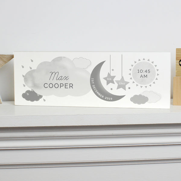 Adorable personalised moon & stars wooden block decoration, a fabulous way of welcoming a new baby to the world.  This sign can be personalised with a first name with 12 characters which is case sensitive and surname with 12 characters which is fixed upper case (on cloud). Date: 20 characters (on moon) Fixed upper case. Weight:  4 characters (on left star) and 4 characters (on right star) Case sensitive. Time : 5 Characters (on sun) with AM/PM Fixed upper case.