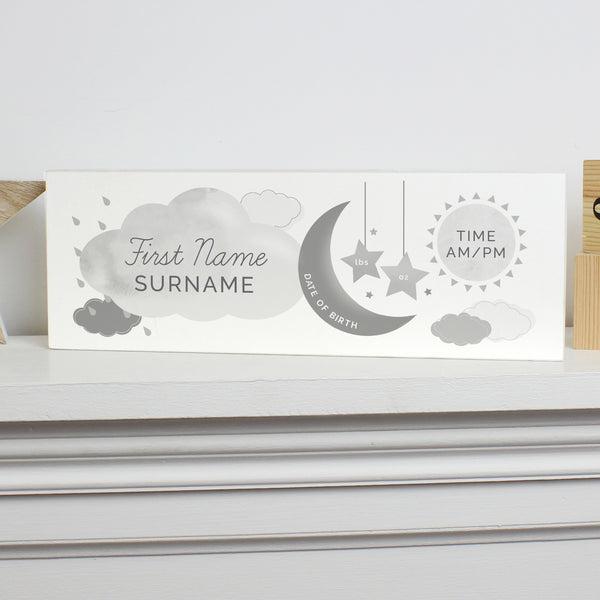 Adorable personalised moon & stars wooden block decoration, a fabulous way of welcoming a new baby to the world.  This sign can be personalised with a first name with 12 characters which is case sensitive and surname with 12 characters which is fixed upper case (on cloud). Date: 20 characters (on moon) Fixed upper case. Weight:  4 characters (on left star) and 4 characters (on right star) Case sensitive. Time : 5 Characters (on sun) with AM/PM Fixed upper case.