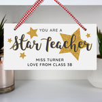 Beautiful wooden hanging sign 'Star Teacher' would make a lovely gift for all the teachers out there.  Personalise this decoration with a name up to 20 characters long and a message with up to 20 character. 'You are a star teacher' is fixed text and cannot be changed.  The personalisation will appear in fixed upper case.