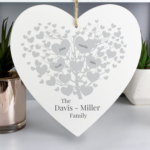 Wooden Hanging Heart with beautiful family tree design which can be personalised with  up to 9 family members.  Personalise with family surname up to 20 Characters and names (1 to 9) up to 12 characters per name. The text will appear as entered.