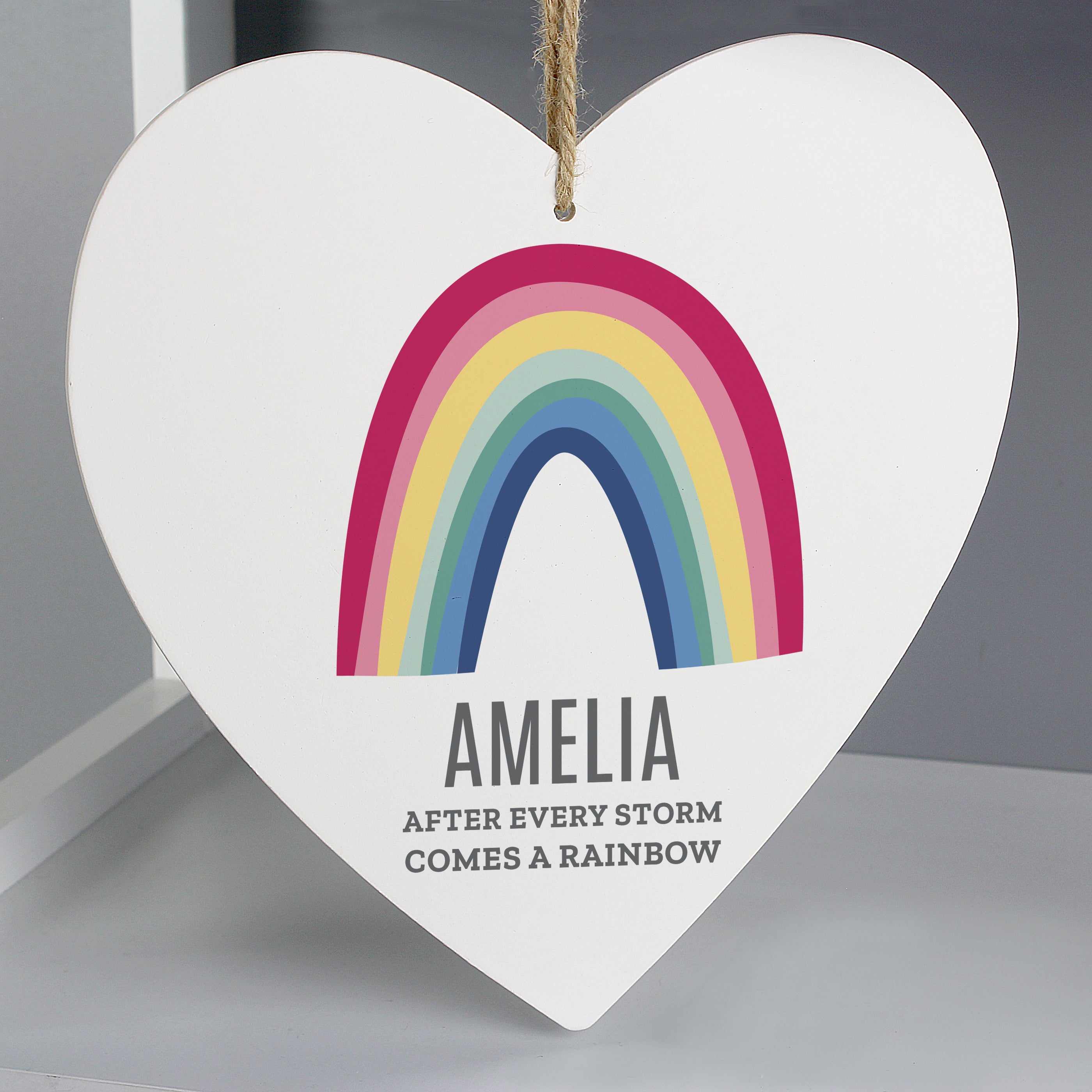 Wooden Hanging Heart with bright rainbow design which can be personalised with a name up to 12 characters and a message with up to 2 lines of 20 characters.