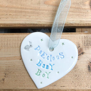 Hand painted ceramic heart featuring bunny and star design and the sentiment 'Precious Baby Boy'  Handmade in the UK using clay, glaze and paint sourced locally.  Material:  Ceramic