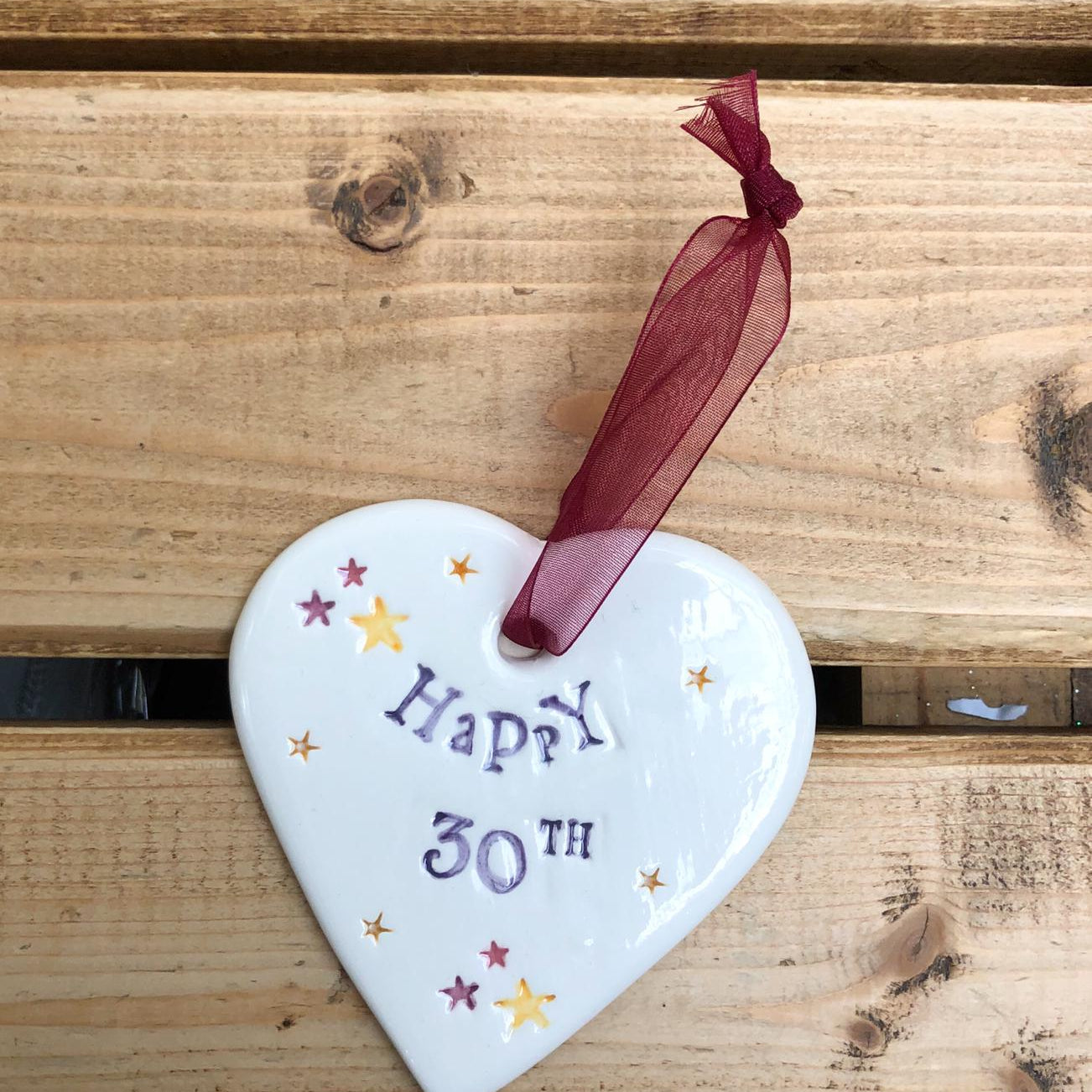 Hand painted ceramic heart featuring star design and the sentiment 'Happy 30th'  Handmade in the UK using clay, glaze and paint sourced locally.  Material:  Ceramic