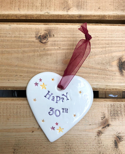 Hand painted ceramic heart featuring star design and the sentiment 'Happy 30th'  Handmade in the UK using clay, glaze and paint sourced locally.  Material:  Ceramic