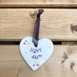 Hand painted ceramic heart featuring star design and the sentiment 'Happy 40th' Handmade in the UK using clay, glaze and paint sourced locally. Material: Ceramic