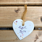 Hand painted ceramic heart featuring star design and the sentiment 'Happy 70th' Handmade in the UK using clay, glaze and paint sourced locally. Material: Ceramic