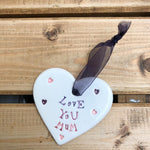 Hand painted ceramic heart featuring a flower design and the sentiment 'Love You Mum'  Handmade in the UK using clay, glaze and paint sourced locally.  Material:  Ceramic