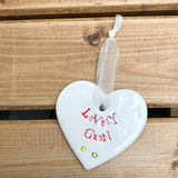 Hand painted ceramic heart featuring a flower design and the sentiment 'Lovely Gran'  Handmade in the UK using clay, glaze and paint sourced locally.  Material:  Ceramic