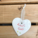 Hand painted ceramic heart featuring a flower design and the sentiment 'Lovely Gran'  Handmade in the UK using clay, glaze and paint sourced locally.  Material:  Ceramic