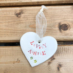 Hand painted ceramic heart featuring a flower design and the sentiment 'Lovely Auntie' Handmade in the UK using clay, glaze and paint sourced locally. Material: Ceram