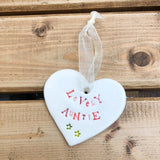 Hand painted ceramic heart featuring a flower design and the sentiment 'Lovely Auntie' Handmade in the UK using clay, glaze and paint sourced locally. Material: Ceram