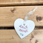 Hand painted ceramic heart featuring a flower design and the sentiment 'Lovely Auntie' Handmade in the UK using clay, glaze and paint sourced locally. Material: Ceram