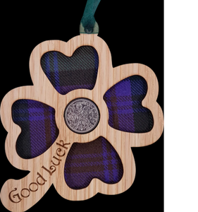 A unique keepsake gift with a Scottish twist.  The sixpence is mounted onto a hanging oak veneered wooden clover with tartan inserts, mounted on card and packaged in clear cellophane packets.  A lucky sixpence is traditionally believed to bring good luck with some families passing down the same sixpence through generations.