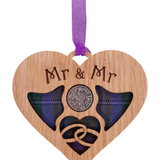 A unique keepsake gift with a Scottish twist.  The sixpence is mounted onto hanging oak veneered wooden heart with tartan inserts, mounted on card and packaged in clear cellophane packets.  The sentiment 'Mr & Mr' is engraved across the heart.