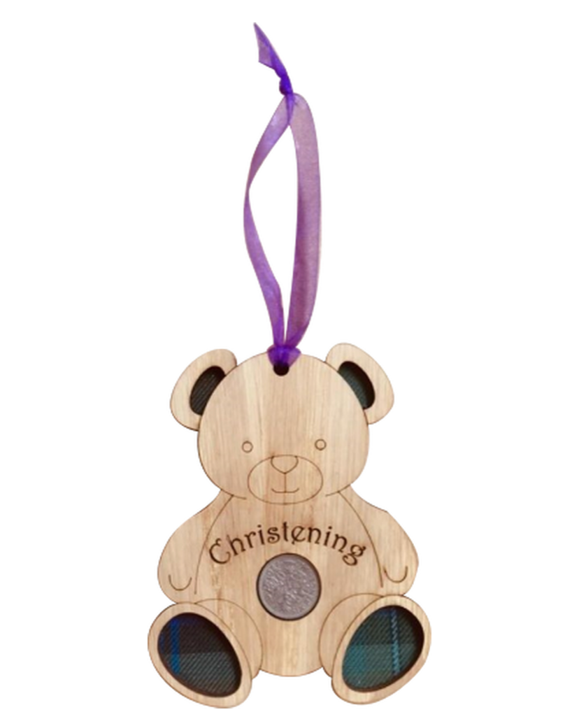 A unique keepsake christening gift with a Scottish twist.  The sixpence is mounted onto an oak veneered wooden teddy with tartan inserts, mounted on card and packaged in clear cellophane packets.