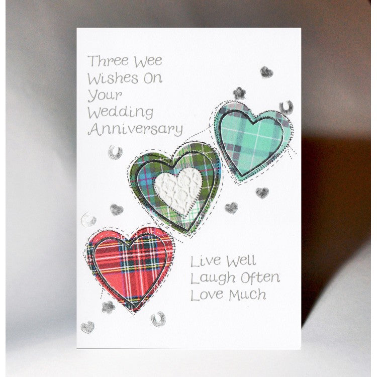 ***Price Includes Delivery ***  Scottish Anniversary Card featuring three tartan hearts and the words  'Three Wee Wishes on Your Wedding Anniversary -  live well, laugh often, love much'  Designed and printed in Scotland  Textured White Card, Silver Foil Highlight  Dimensions: 10.5cm x 15cm  We can send direct to recipient free of charge including a handwritten message inside .... simply add a note to your order (from cart page) including your message.  