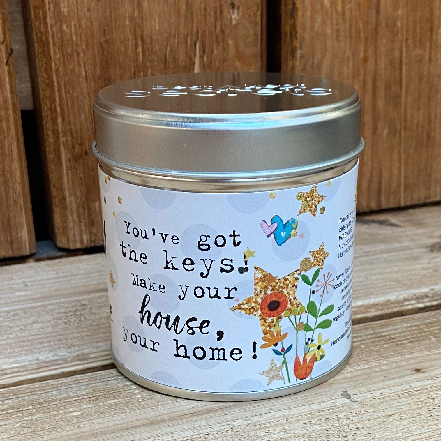 Tin new home candle with message