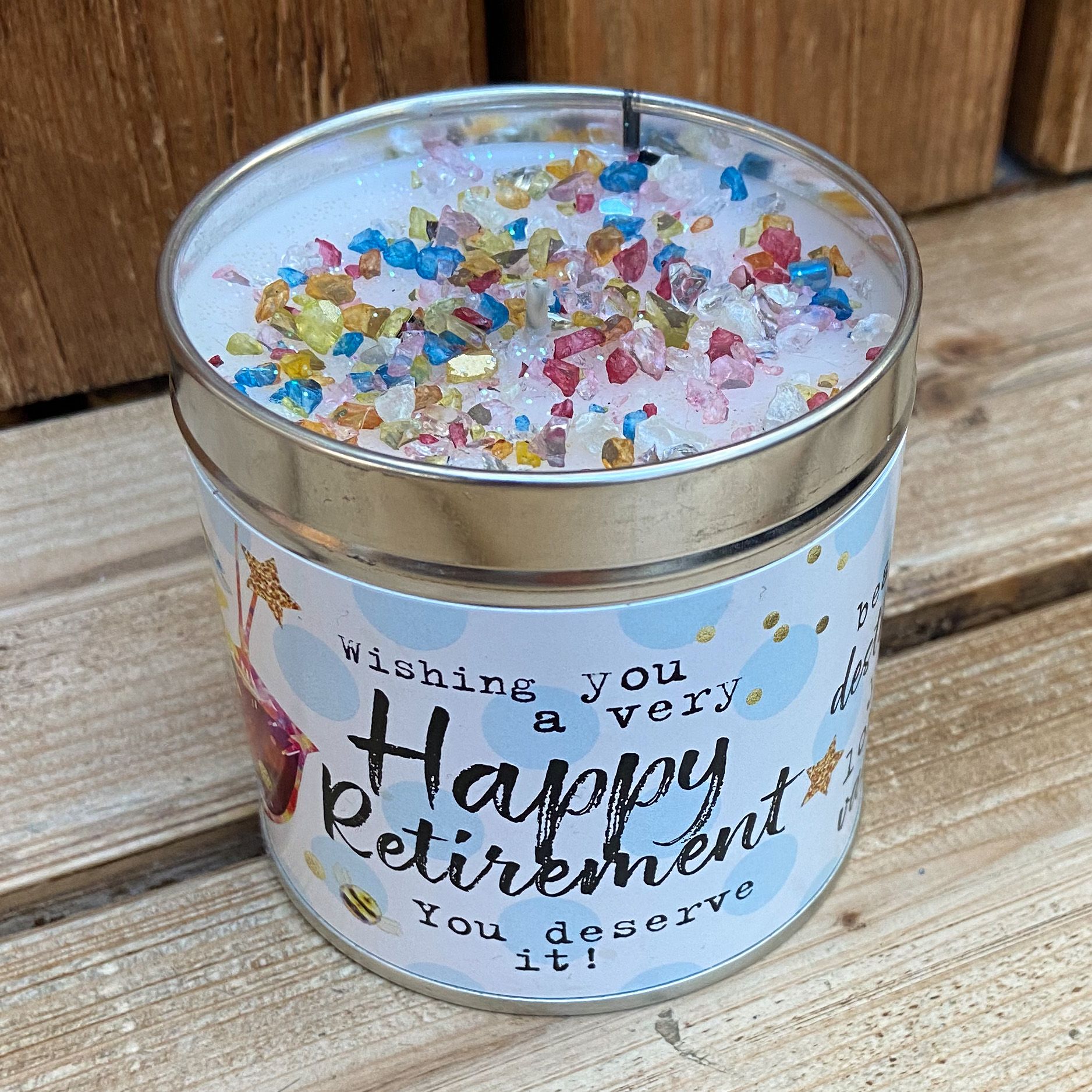 Tin happy retirement candle with a dded sparkles