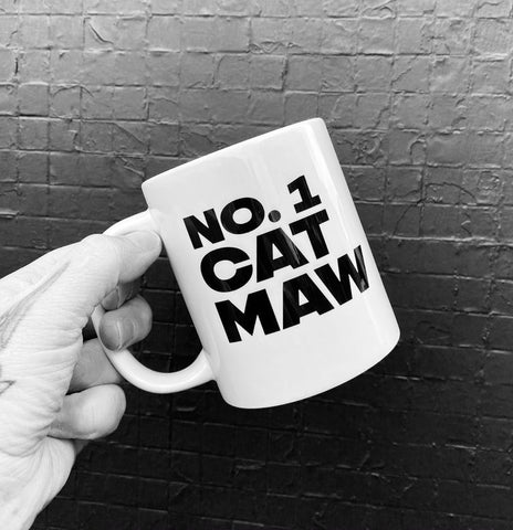 Mug with the slogan 'No 1 Cat Maw' ......The perfect gift for that cat mum with a sense of humour .  Other variations available.  Printed in Glasgow.    Mug comes boxed.    Material:  11oz White Ceramic Mug