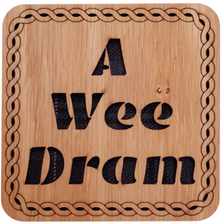 Wooden coaster with tartan insert and cut out text:  'A Wee Dram' ﻿