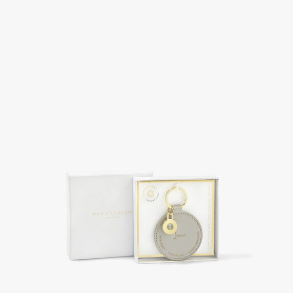 This beautiful keyring from much loved brand Katie Loxton with pretty Moonstone charm, comes in a beautiful pale grey colour which features the golden embossed month 'June' and three traits that perfectly reflect those born in this month - friendly, inspiring and warm hearted!